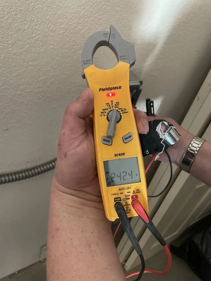 Voltage testing with clamp meter during Aluminum Wiring Replacement in Harvest